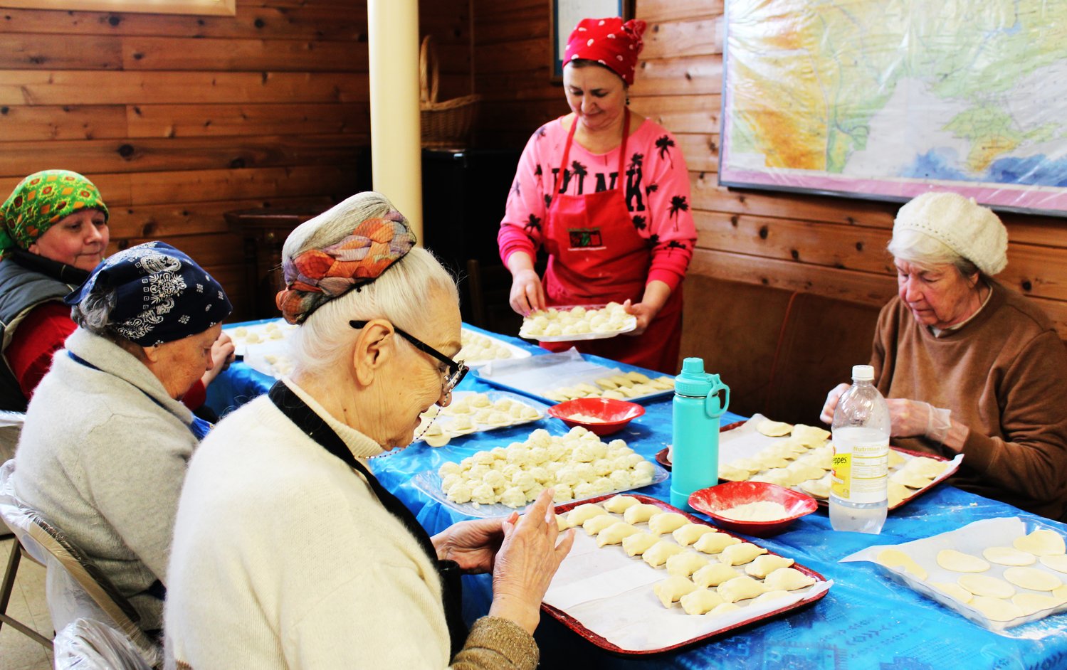 Klaudia Konrad, Anna Pleskun, Maria Nakonczna, Irina Malyuk and Dadia Boychew apply just the right “feel” to sealing the pierogi dough around the potato-and-cheese filling.